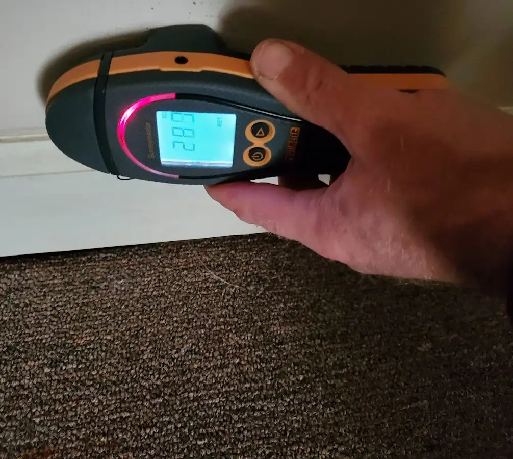 Moisture detection at baseboard during Storm Damage Restoration in Rittman